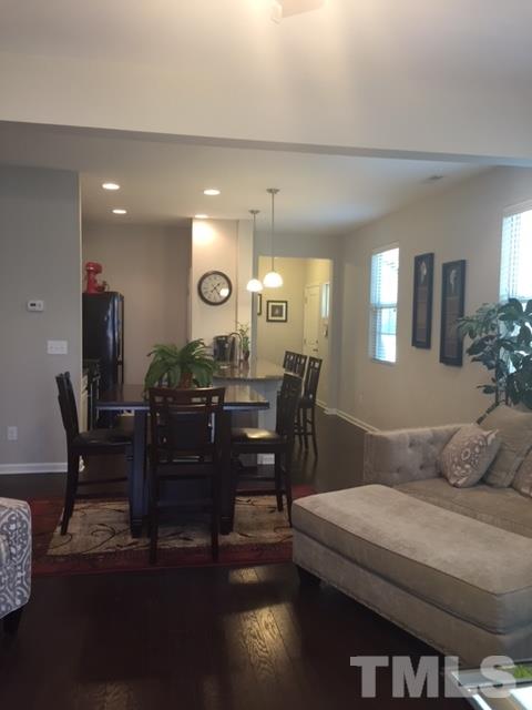 738 Wickham Ridge Road Apex, NC 27539 - Photo 12 of 23 a view of a dining room with furniture