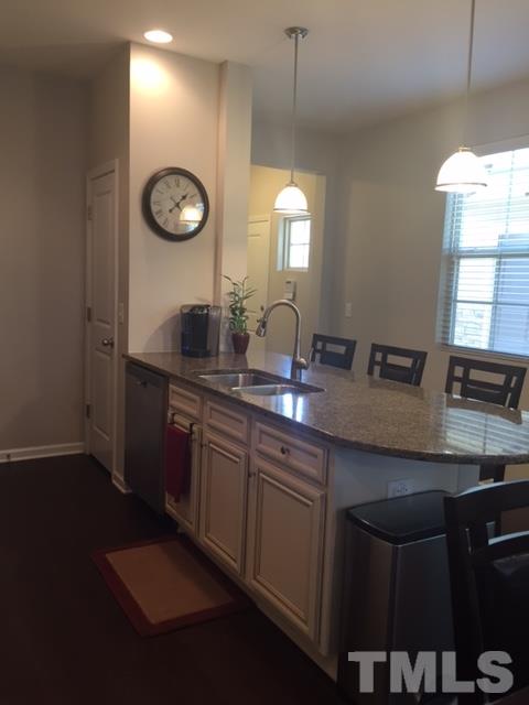 738 Wickham Ridge Road Apex, NC 27539 - Photo 5 of 23 a kitchen with a sink cabinets and window