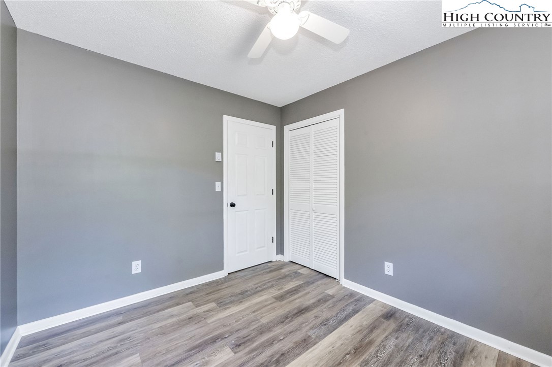 393 Carter Miller Road Todd, NC 28684 - Photo 19 of 48 wooden floor in an empty room