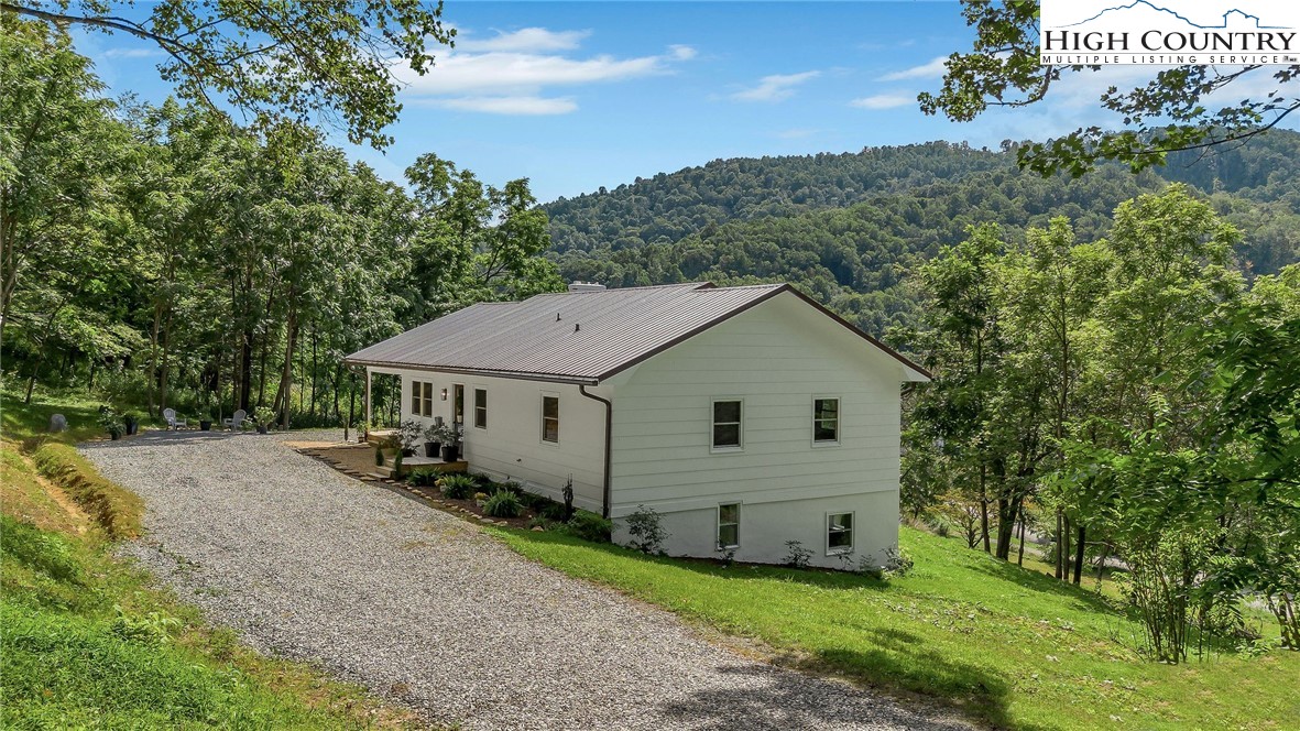 393 Carter Miller Road Todd, NC 28684 - Photo 10 of 48 an aerial view of a house with yard