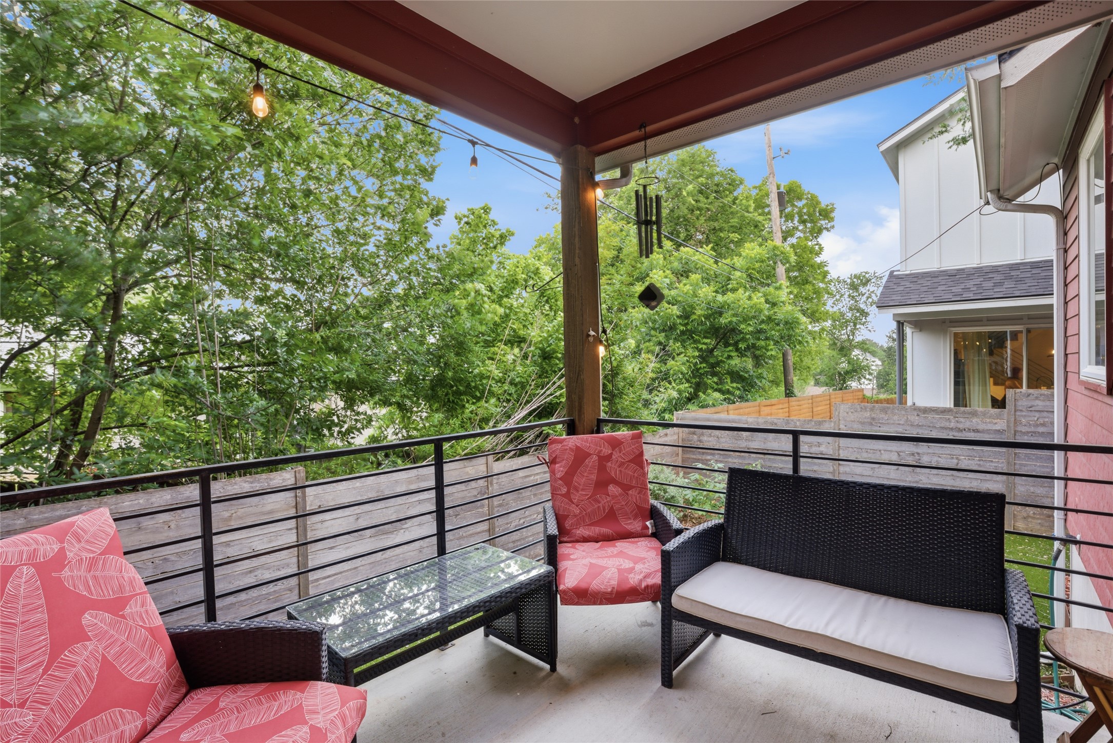 1709 Perez Street, Unit 2 Austin, TX 78721 - Photo 29 of 33 A breezy outdoor deck provides a serene spot to relax, with abundant natural greenery creating a private atmosphere.
