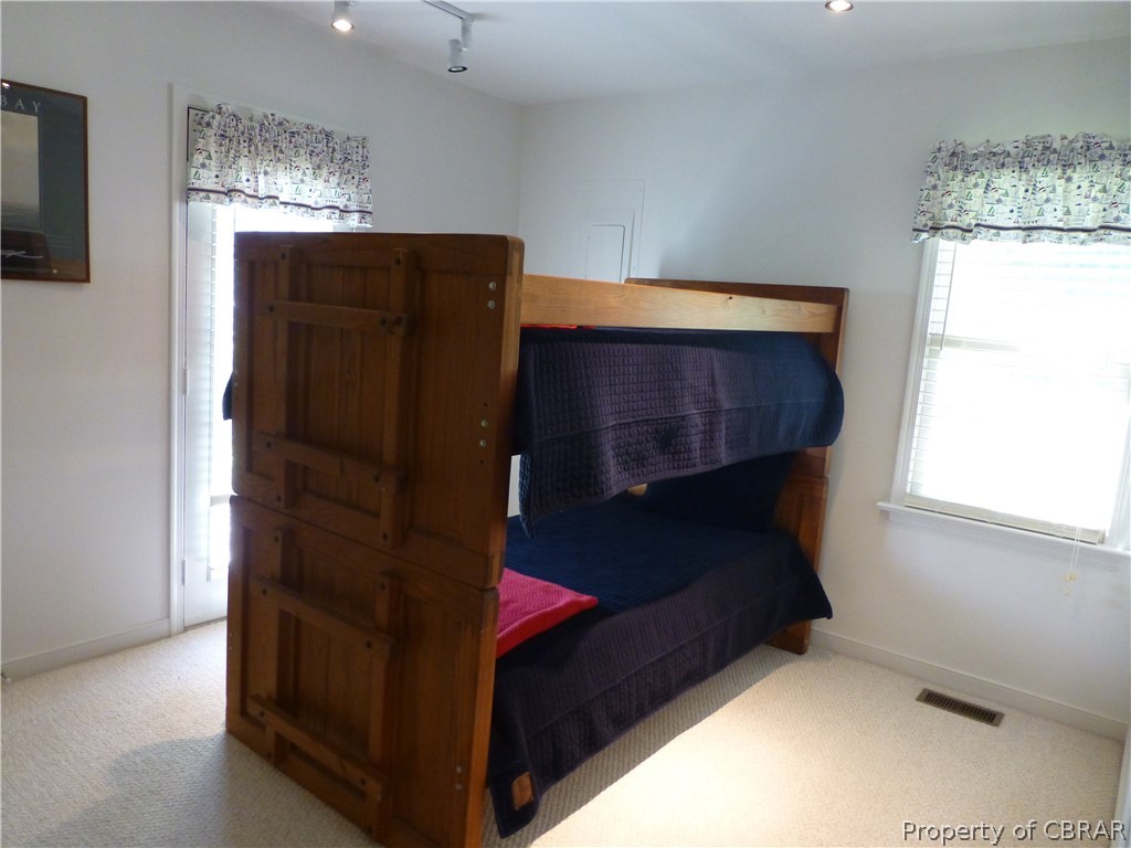 464 Jackson Creek Road Deltaville, VA 23043 - Photo 12 of 26 Bedroom with access to covered porch and Jack & Jill bath