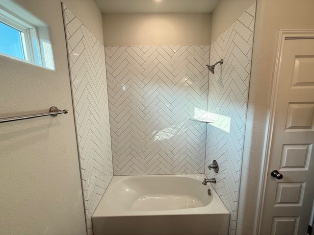 7809 Redbud Road Navasota, TX 77868 - Photo 14 of 18 a bathroom with a bathtub