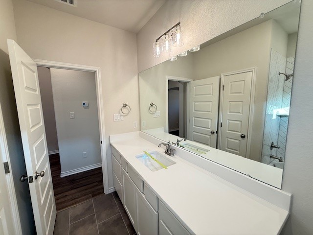 7809 Redbud Road Navasota, TX 77868 - Photo 15 of 18 a bathroom with a sink a mirror and a shower