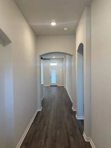 a view of gallery with wooden floor