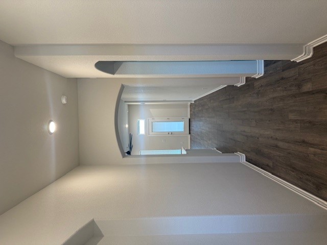 7809 Redbud Road Navasota, TX 77868 - Photo 2 of 18 a view of gallery with wooden floor