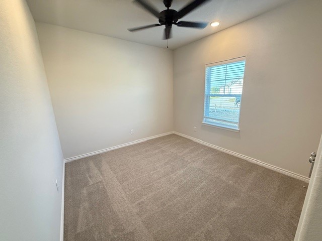 7809 Redbud Road Navasota, TX 77868 - Photo 10 of 18 an empty room with a window and a ceiling fan