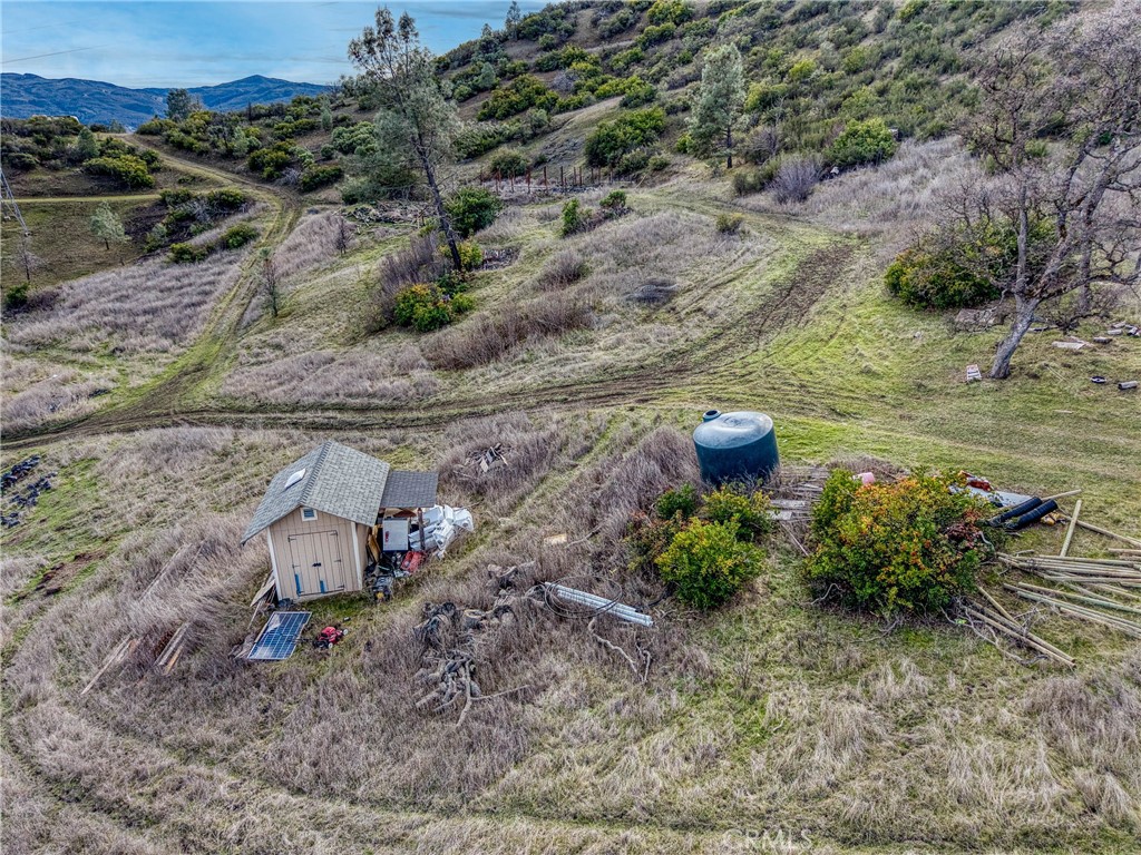 162 Mule Skinner Road Clearlake Oaks, CA 95423 - Photo 15 of 25 a garden view with a sitting space