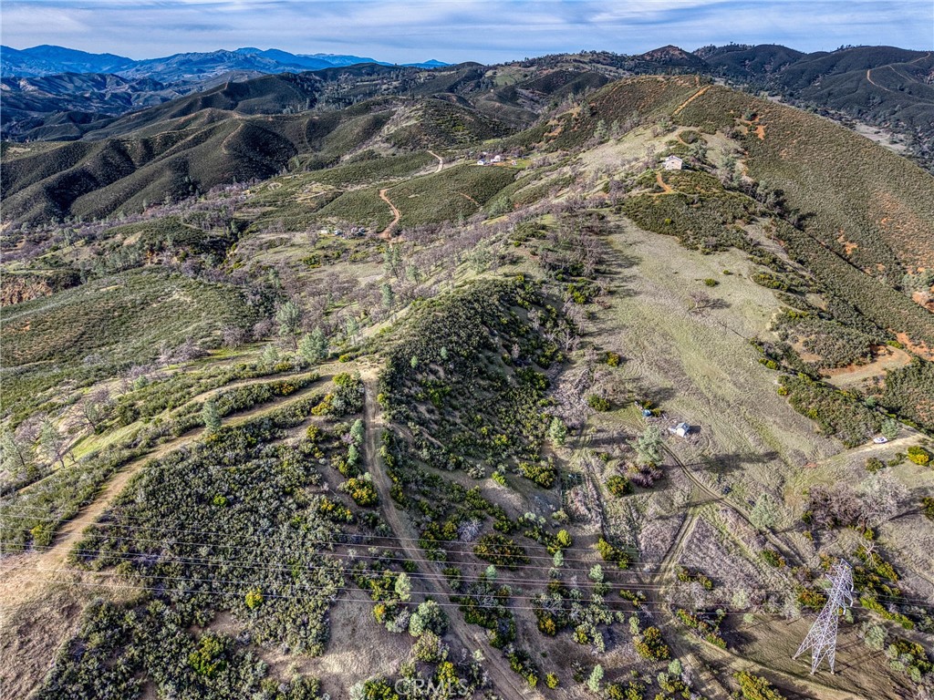162 Mule Skinner Road Clearlake Oaks, CA 95423 - Photo 2 of 25 a view of a forest with mountains and mountain view