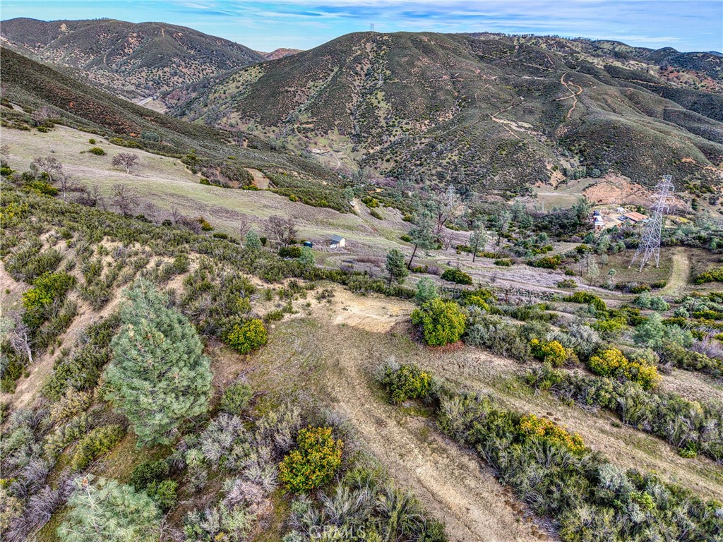 162 Mule Skinner Road Clearlake Oaks, CA 95423 - Photo 9 of 25 a view of a road with mountains in the background