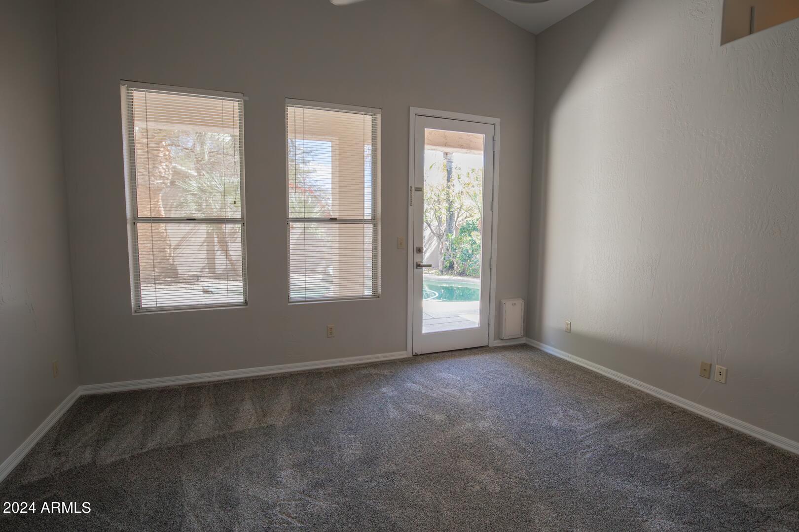 16051 South 24th Place Phoenix, AZ 85048 - Photo 20 of 42 an empty room with windows