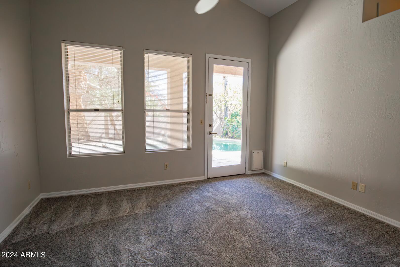 16051 South 24th Place Phoenix, AZ 85048 - Photo 21 of 42 an empty room with windows