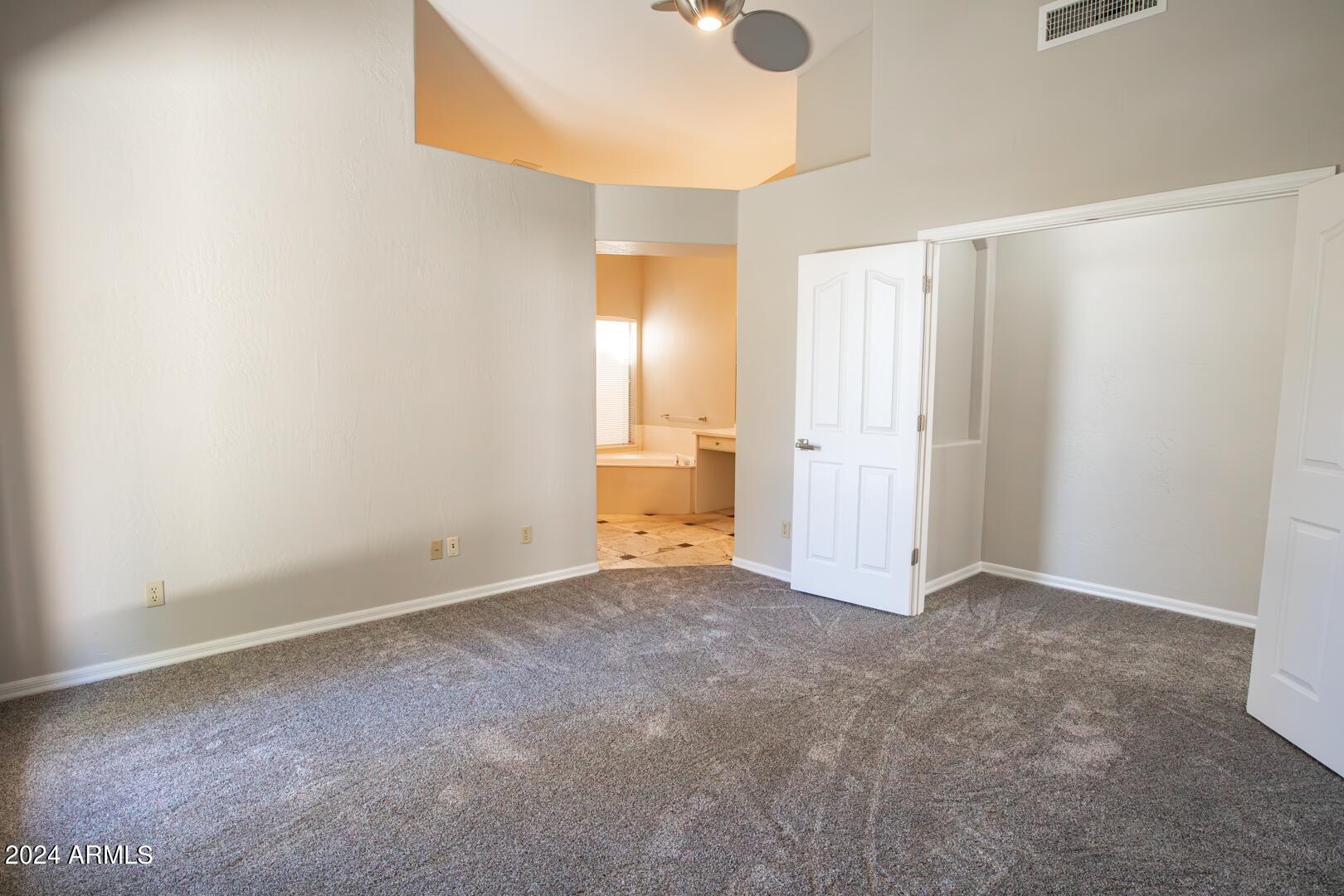 16051 South 24th Place Phoenix, AZ 85048 - Photo 22 of 42 a view of an empty room and a window