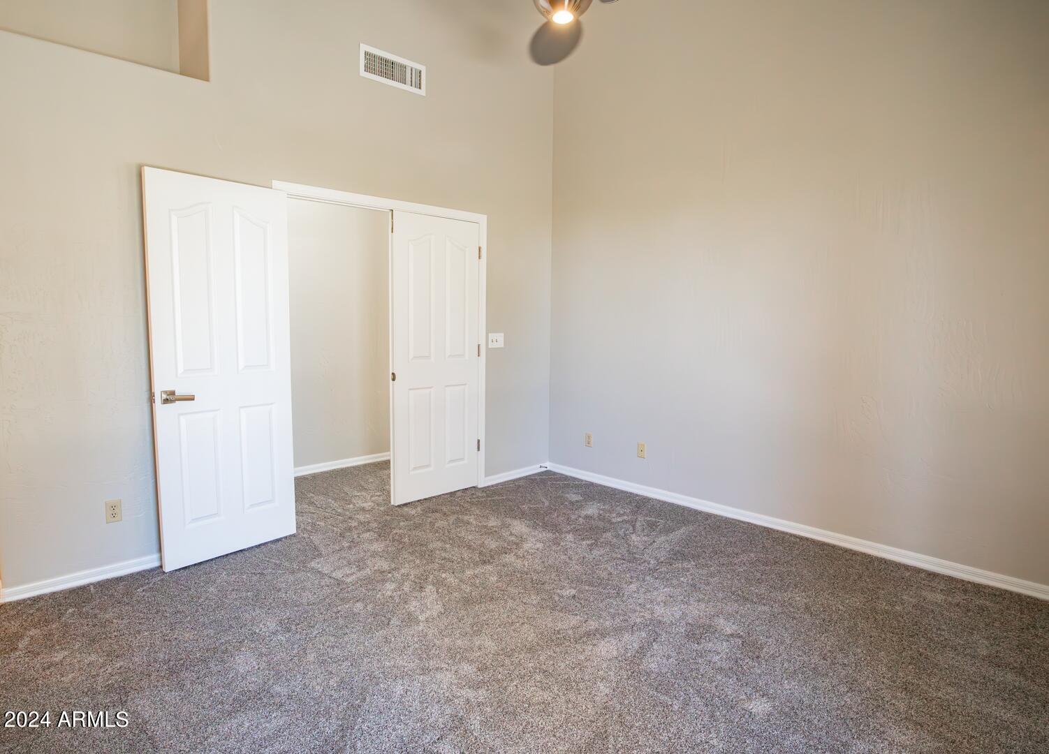 16051 South 24th Place Phoenix, AZ 85048 - Photo 23 of 42 an empty room with closet area