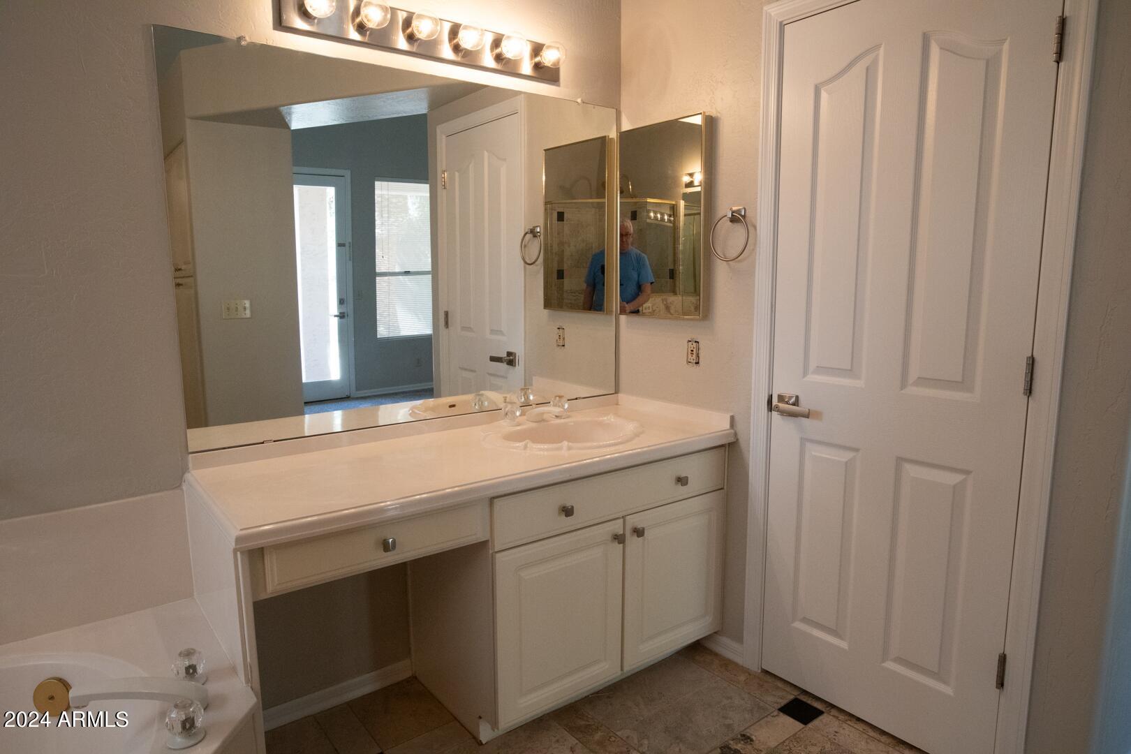 16051 South 24th Place Phoenix, AZ 85048 - Photo 28 of 42 a bathroom with a double vanity sink and mirror