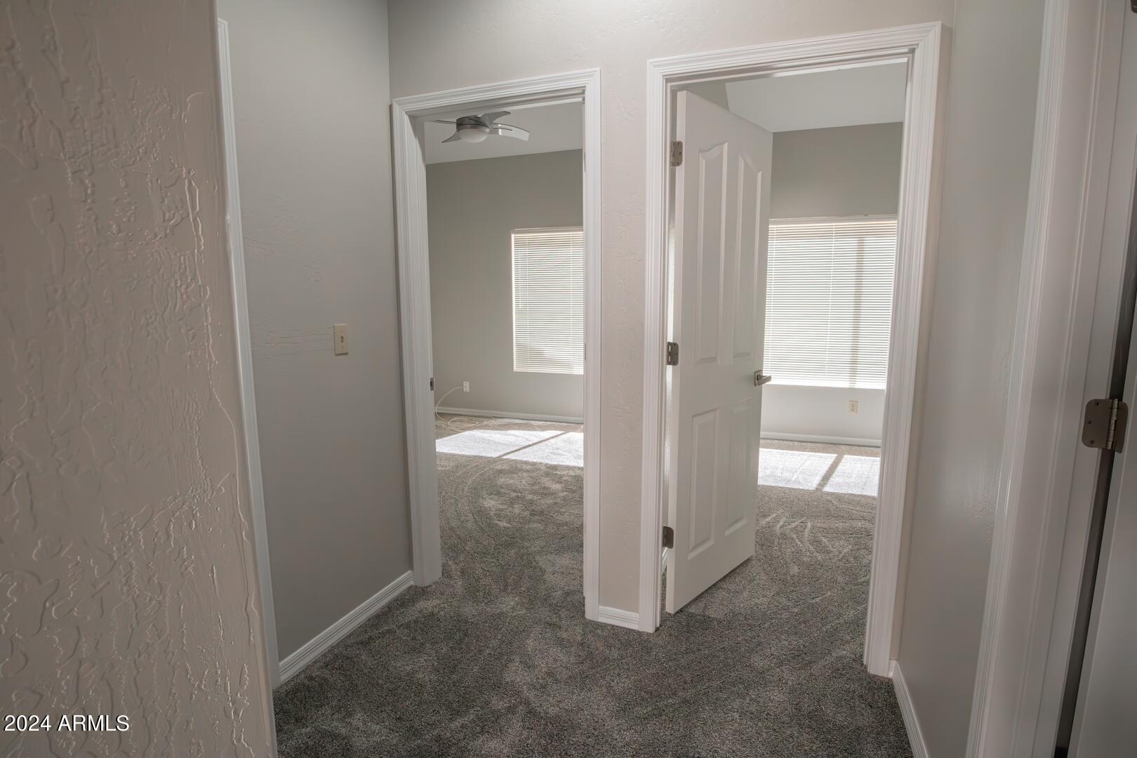 16051 South 24th Place Phoenix, AZ 85048 - Photo 29 of 42 a view of an empty room with mirror