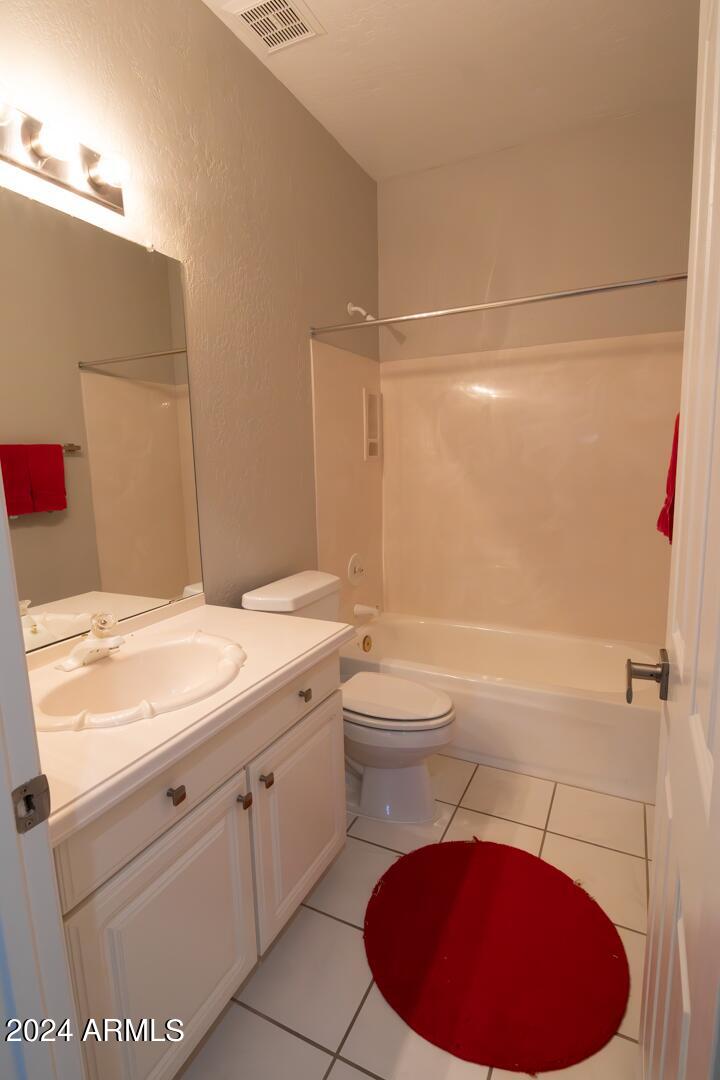 16051 South 24th Place Phoenix, AZ 85048 - Photo 30 of 42 a bathroom with a sink toilet vanity and shower