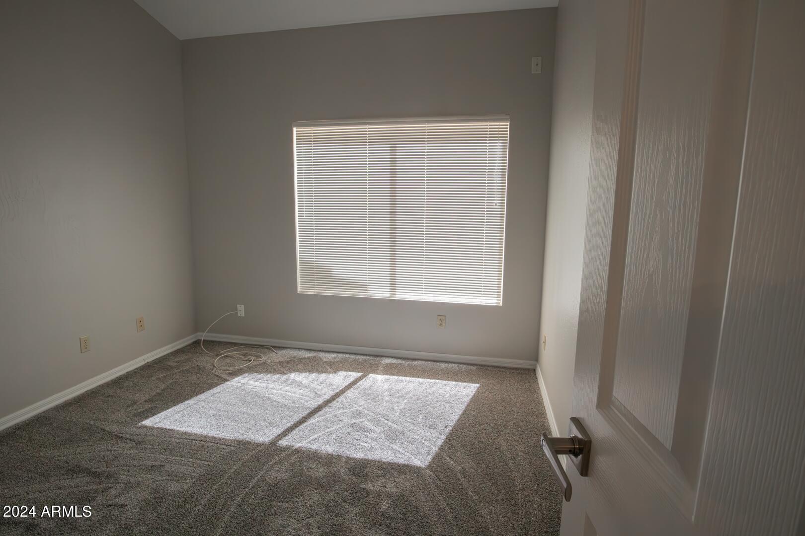 16051 South 24th Place Phoenix, AZ 85048 - Photo 31 of 42 an empty room with a window