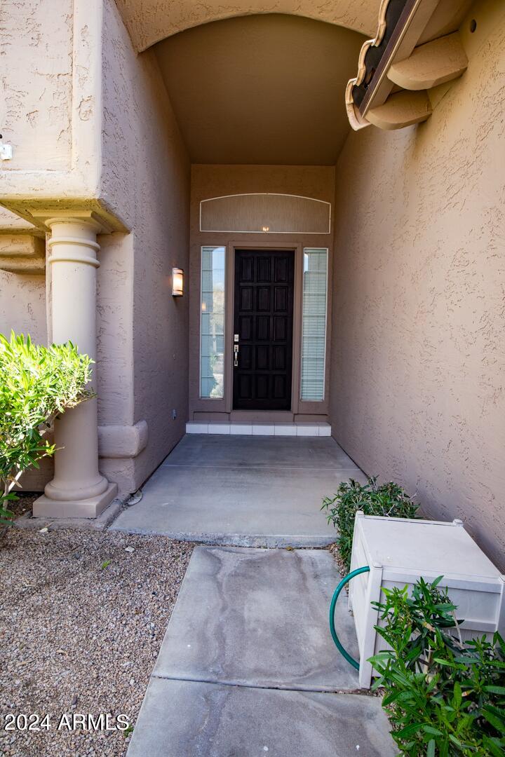 16051 South 24th Place Phoenix, AZ 85048 - Photo 4 of 42 a view of a entryway door of the house