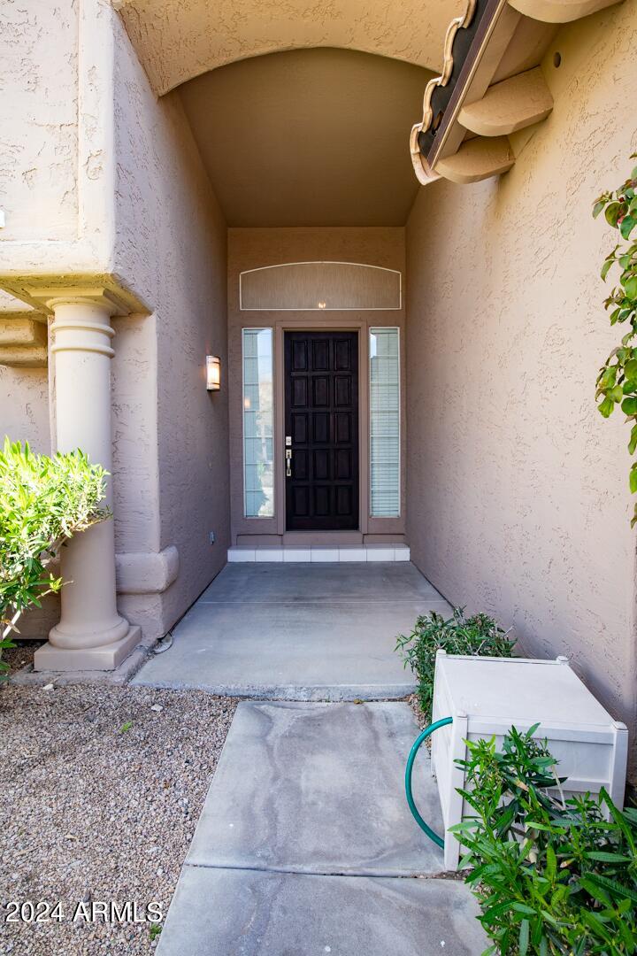16051 South 24th Place Phoenix, AZ 85048 - Photo 5 of 42 a view of a entryway door of the house