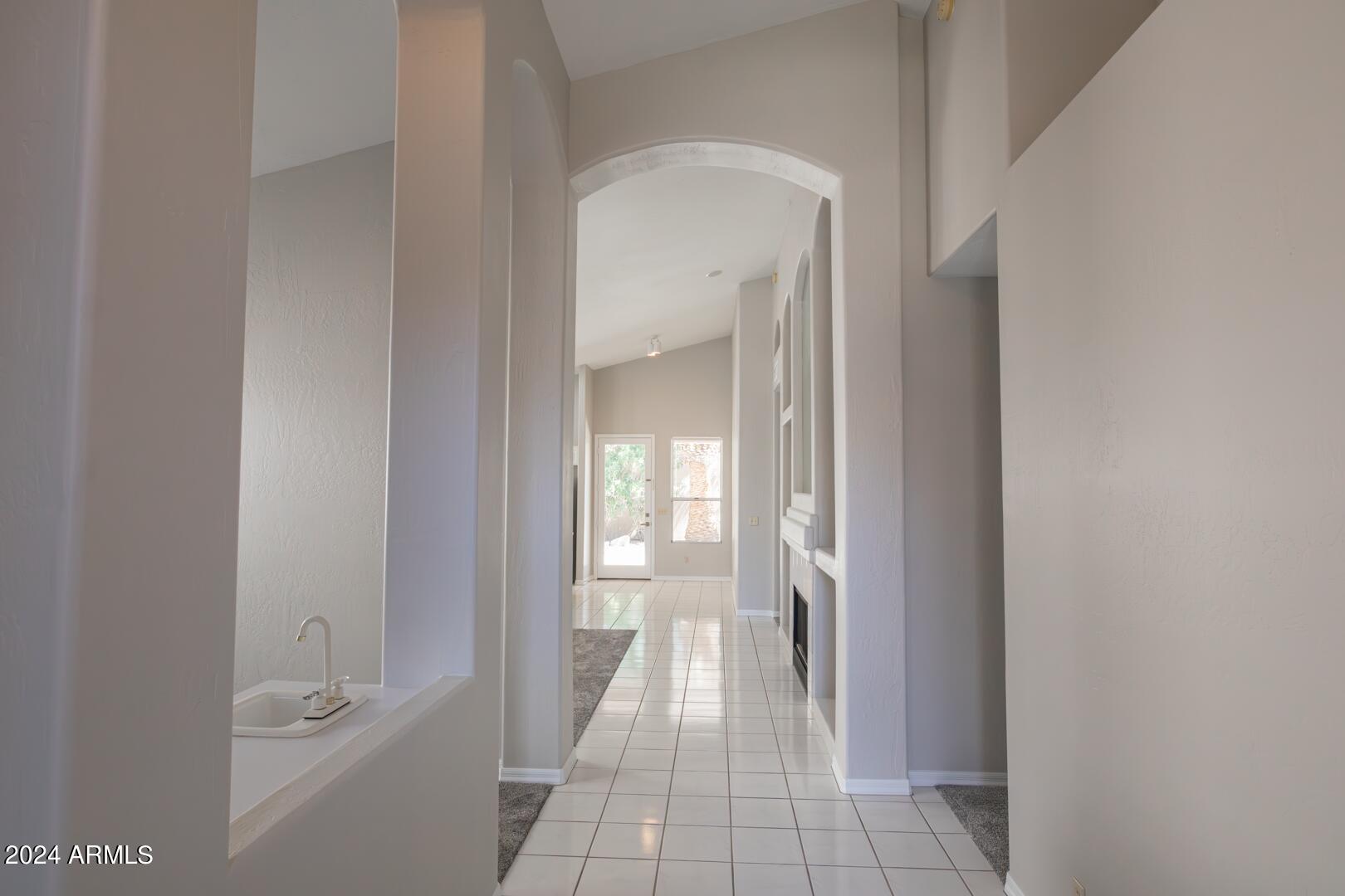 16051 South 24th Place Phoenix, AZ 85048 - Photo 6 of 42 a bathroom with a glass door shower
