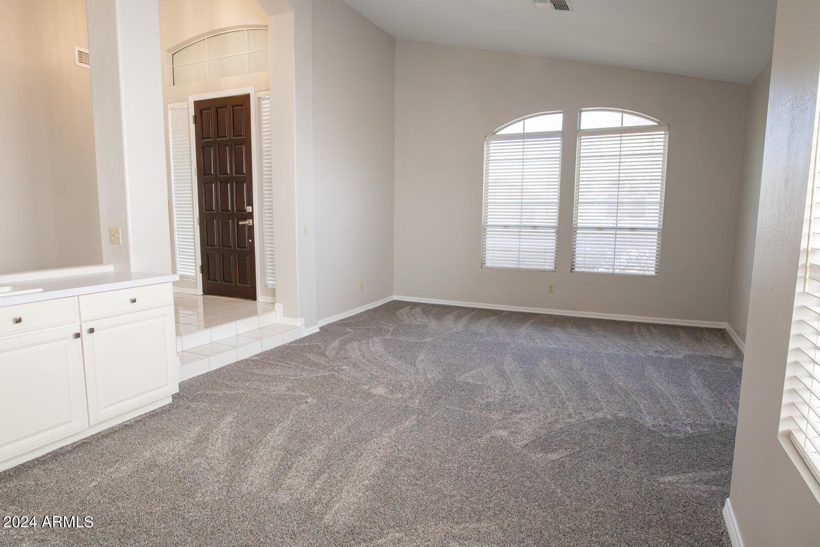 16051 South 24th Place Phoenix, AZ 85048 - Photo 8 of 42 an empty room with windows