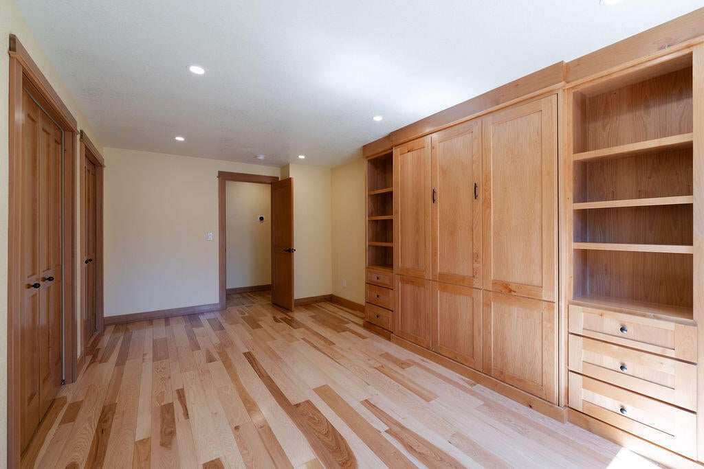 61275 Victory Loop Bend, OR 97702 - Photo 41 of 59 This room offers plenty of storage with built-in cabinets and dual closets