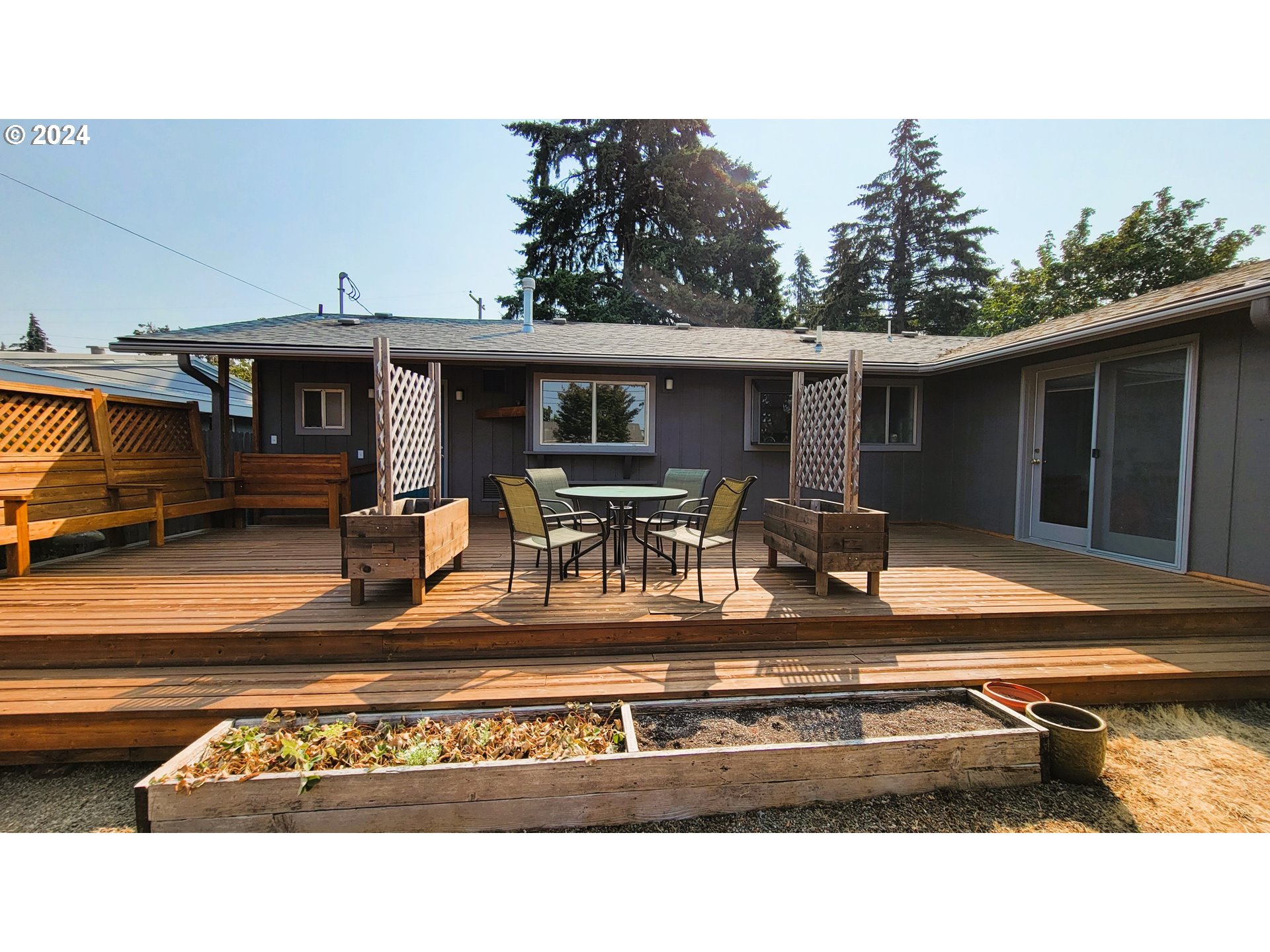 2564 Nova Street Springfield, OR 97477 - Photo 21 of 29 a view of a house with backyard porch and sitting area