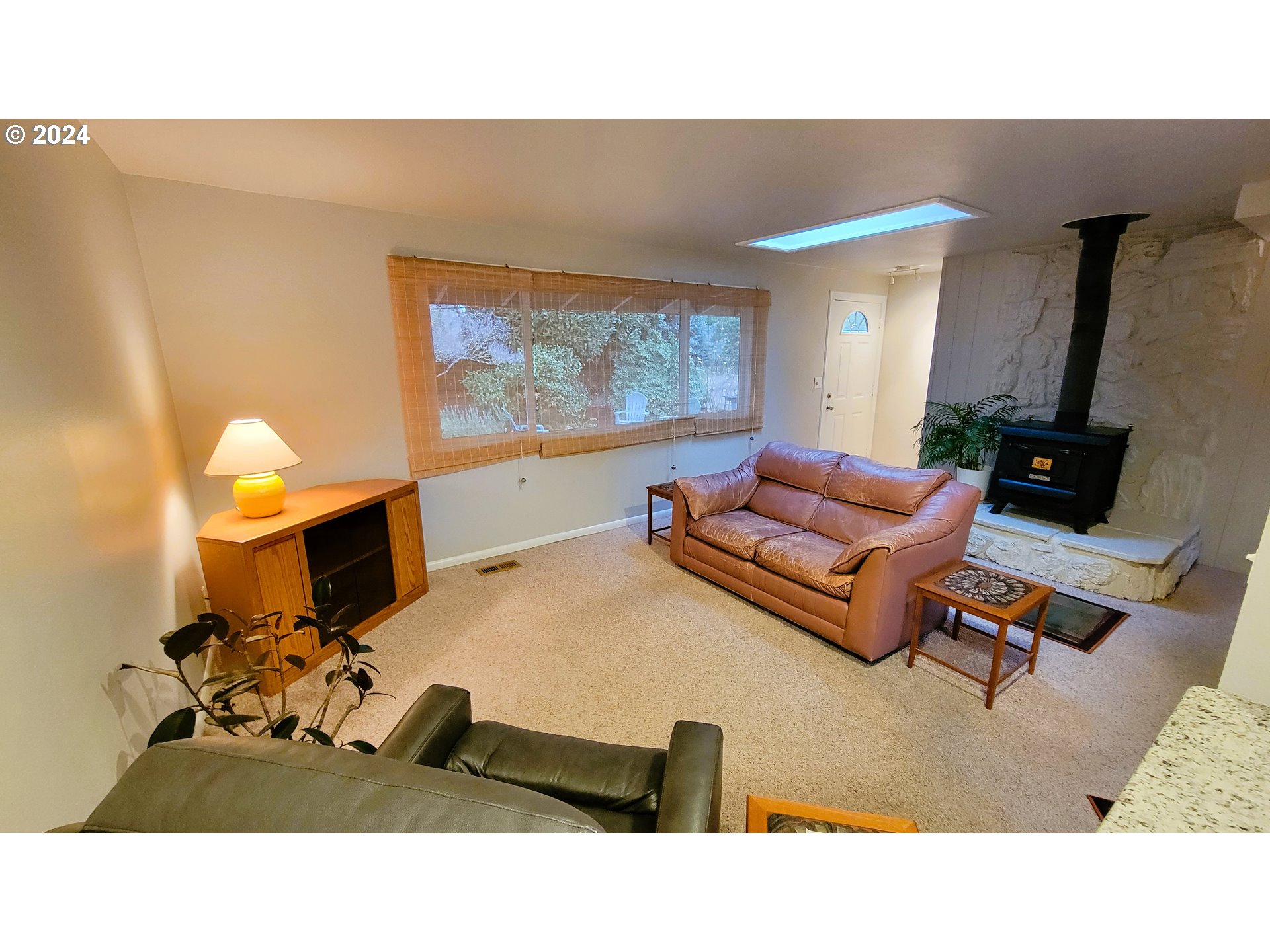 2564 Nova Street Springfield, OR 97477 - Photo 5 of 29 a living room with furniture and a flat screen tv