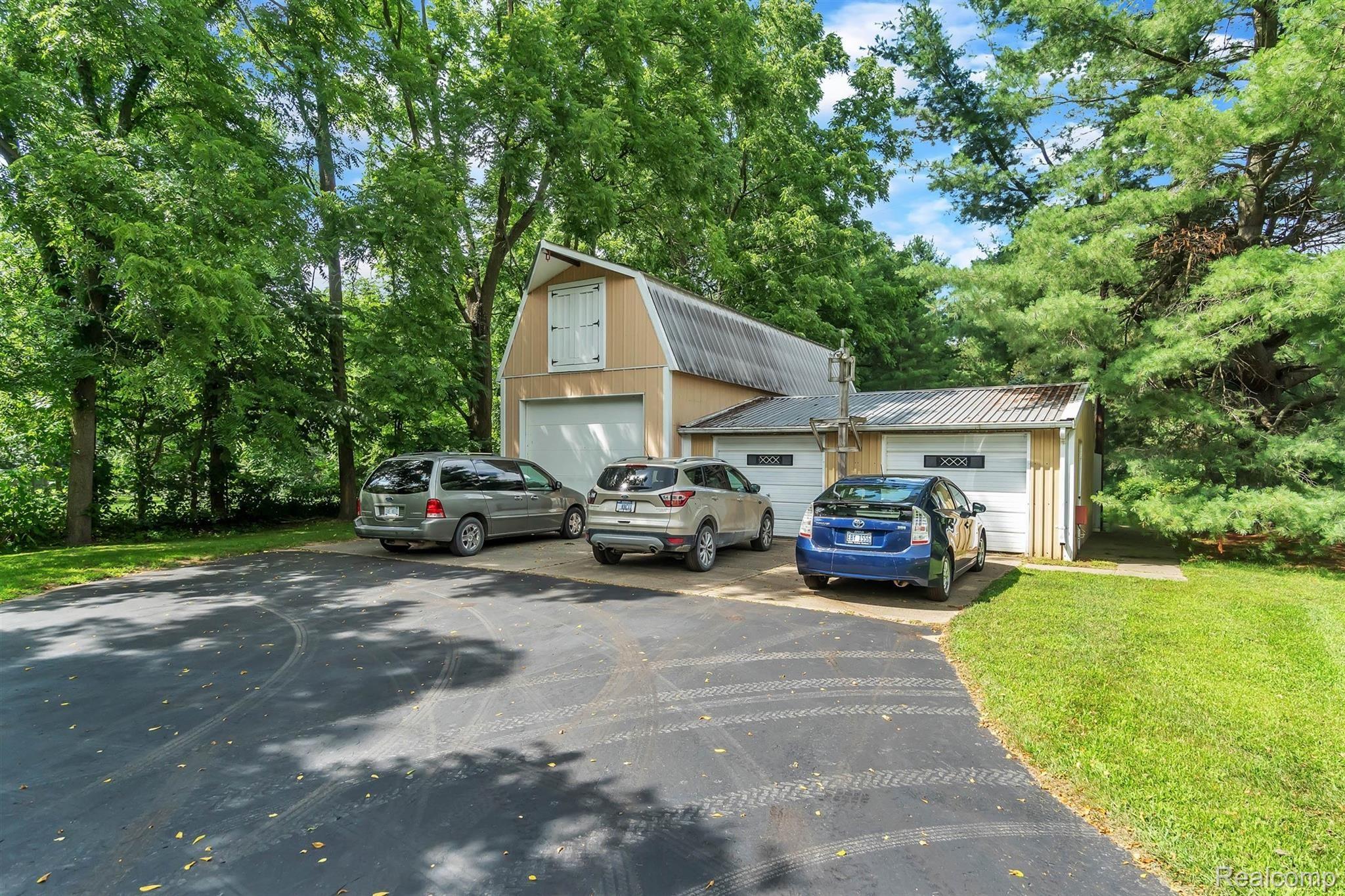 10100 West Allen Road Fowlerville, MI 48836 - Photo 34 of 44 Pole Barn is 20x42, with backside heated room, loft space & doors, metal roofing!Garage is 2.5 car size. Lean - to garden shed in the back!