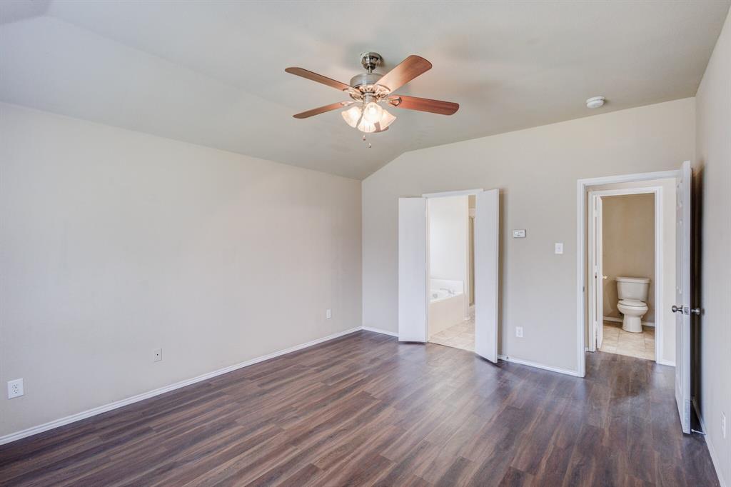 7310 Northpoint Drive Rowlett, TX 75089 - Photo 12 of 32 a view of an empty room with wooden floor