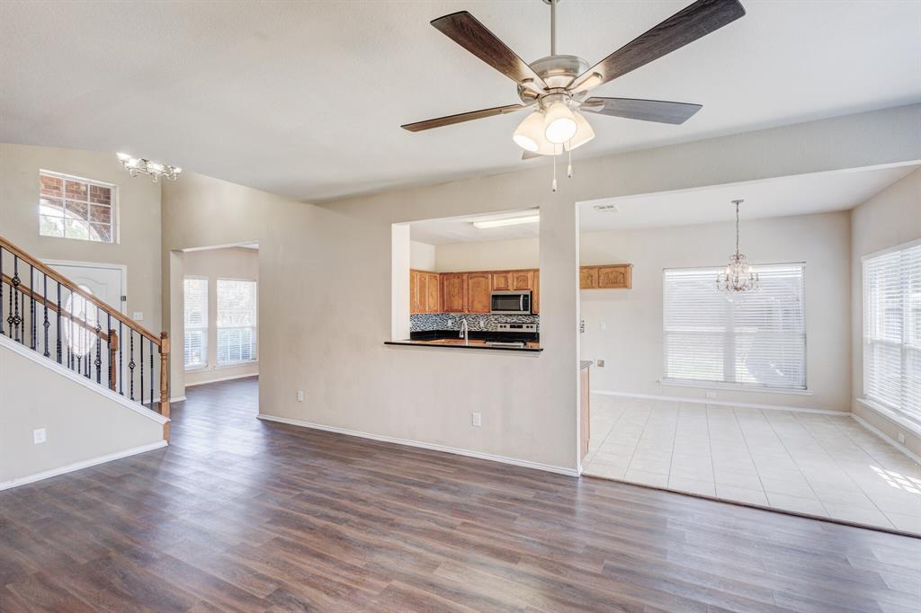7310 Northpoint Drive Rowlett, TX 75089 - Photo 17 of 32 wooden floor in an empty room with a window