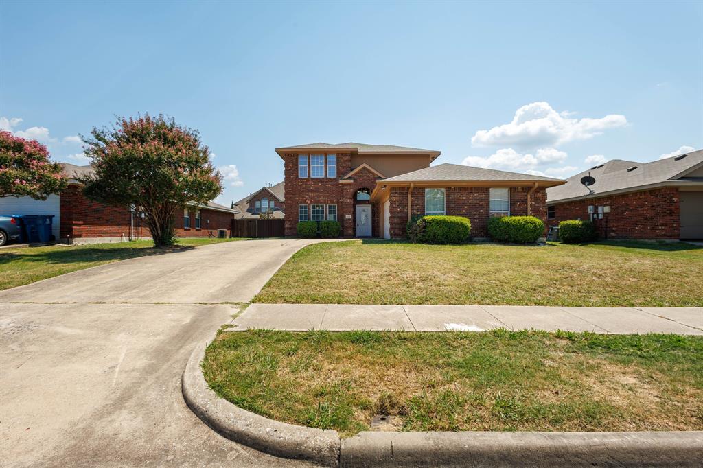 7310 Northpoint Drive Rowlett, TX 75089 - Photo 2 of 32 a view of a house with a yard