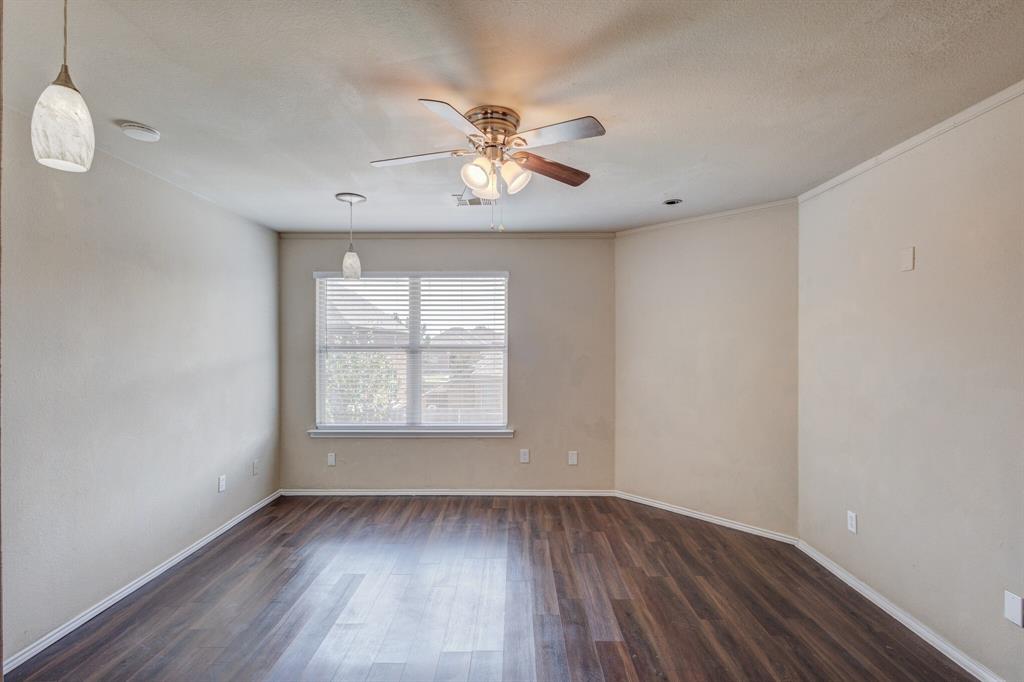 7310 Northpoint Drive Rowlett, TX 75089 - Photo 25 of 32 wooden floor in an empty room with a window