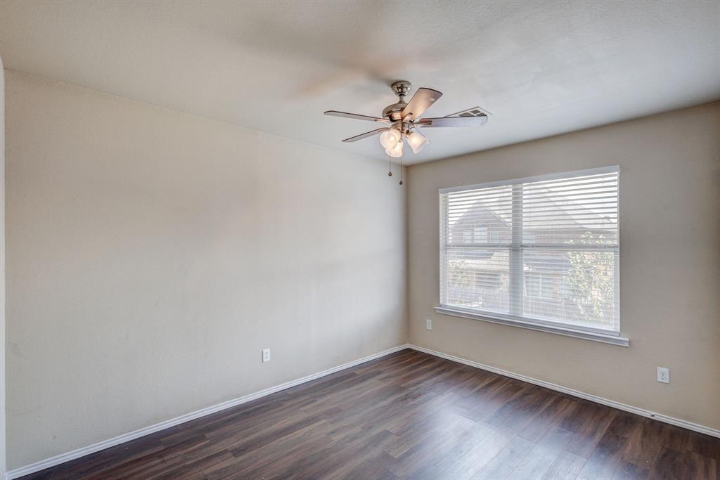 7310 Northpoint Drive Rowlett, TX 75089 - Photo 27 of 32 wooden floor in an empty room with a window