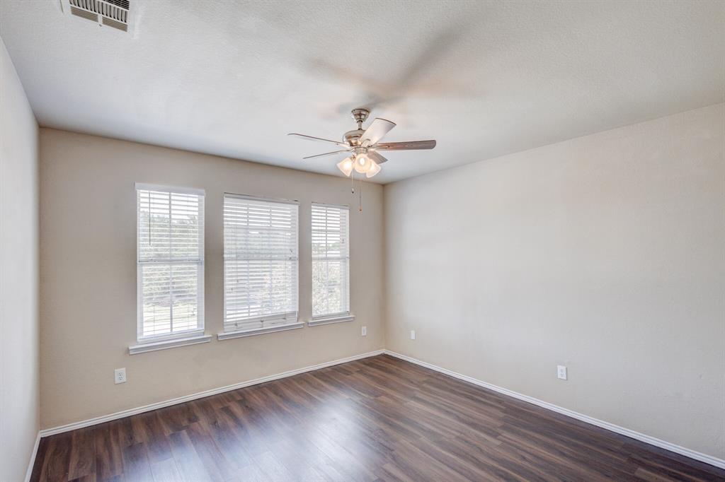7310 Northpoint Drive Rowlett, TX 75089 - Photo 28 of 32 wooden floor in an empty room with a window