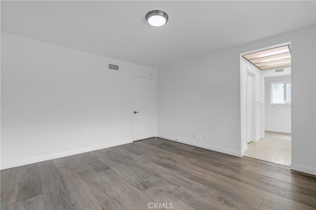 19451 Eagle Ridge Lane Porter Ranch, CA 91326 - Photo 34 of 59 an empty room with wooden floor and windows