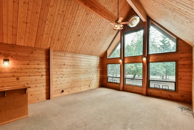 a view of an empty room and windows