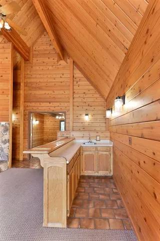 a bathroom with a shower and a sink