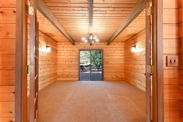 a view of an empty room and entryway