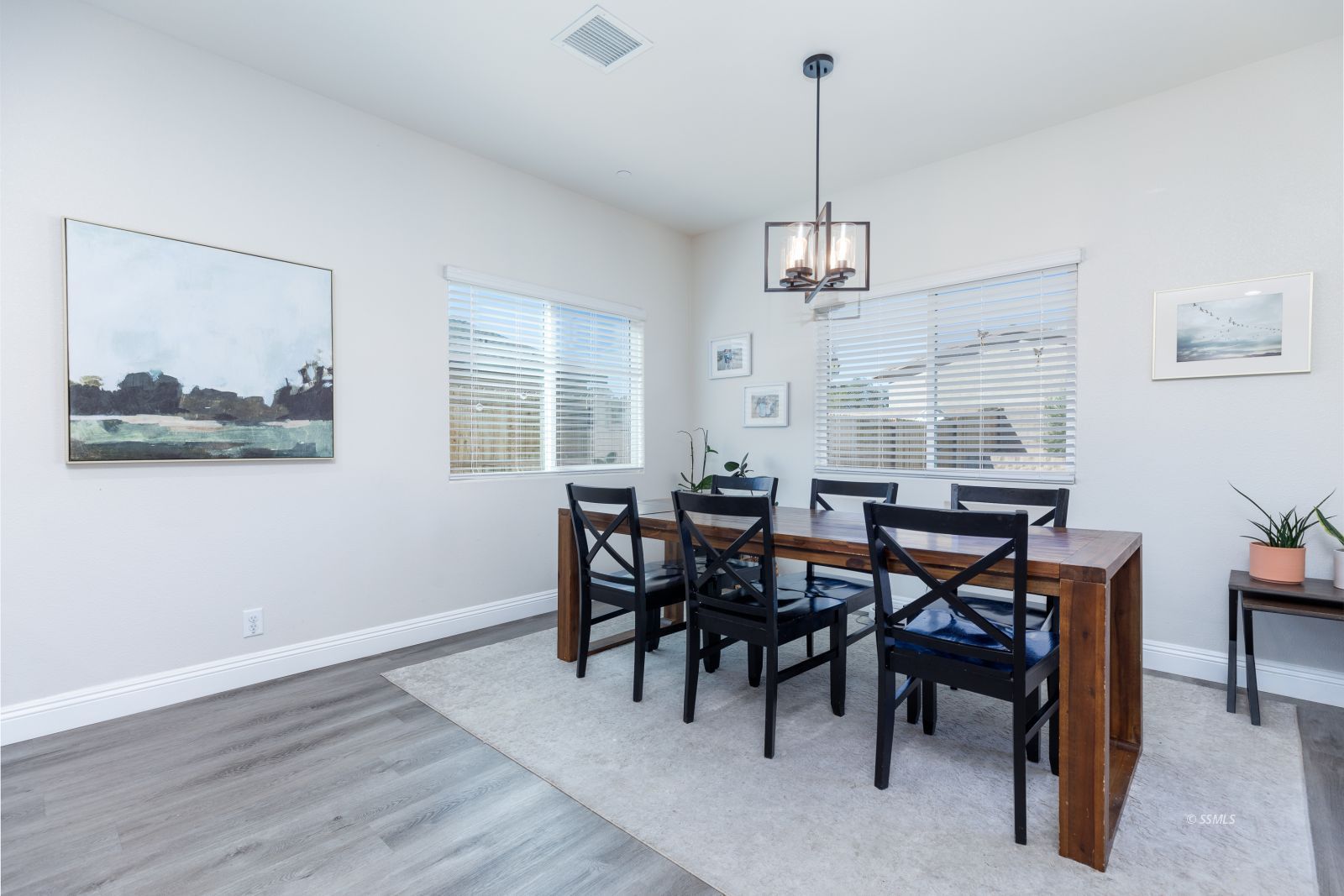 809 Paradise Drive Ridgecrest, CA 93555 - Photo 15 of 35 a view of a dining room with furniture window and wooden floor