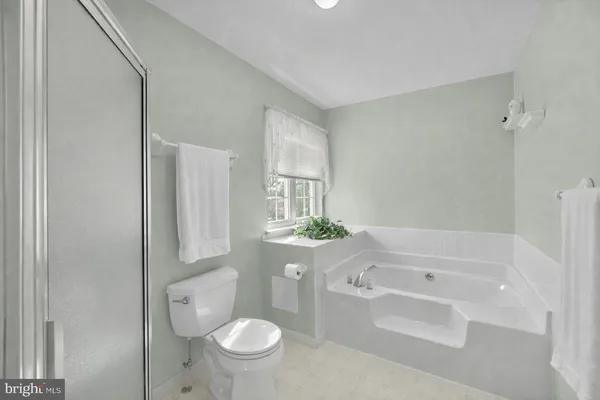 a bathroom with a sink a toilet and bathtub