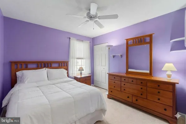 a bedroom with a bed and a dresser