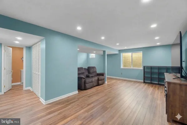 a view of livingroom with furniture wooden floor and window