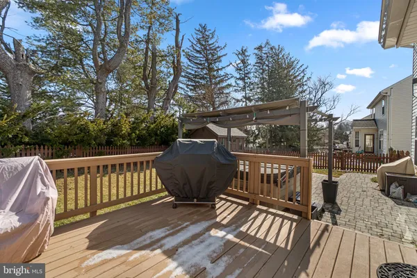 a view of balcony with wooden floor and outdoor seating