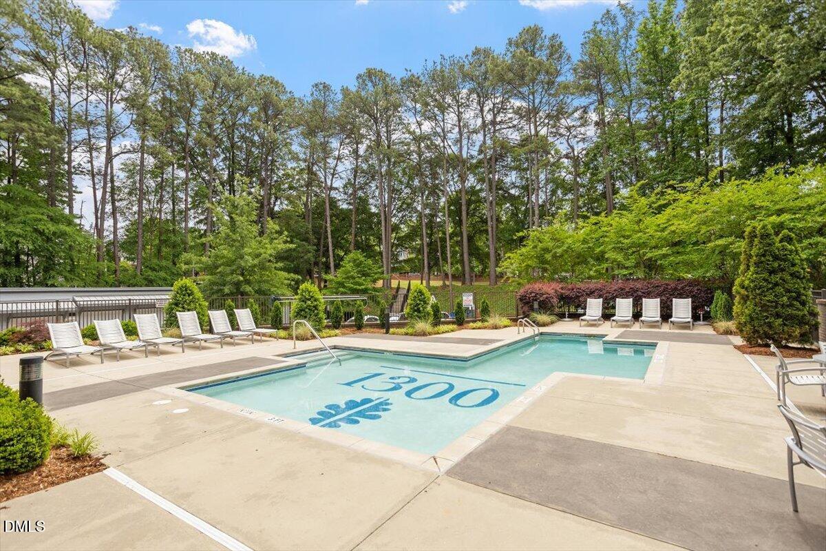 1300 St Marys Street, Unit 207 Raleigh, NC 27605 - Photo 20 of 31 a view of a swimming pool and lounge chair