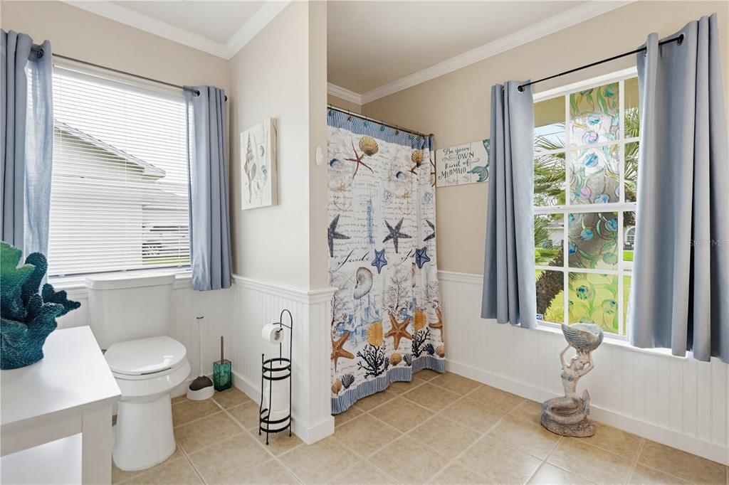 3497 Chadwick Avenue Spring Hill, FL 34609 - Photo 28 of 47 a bathroom with a toilet sink and shower