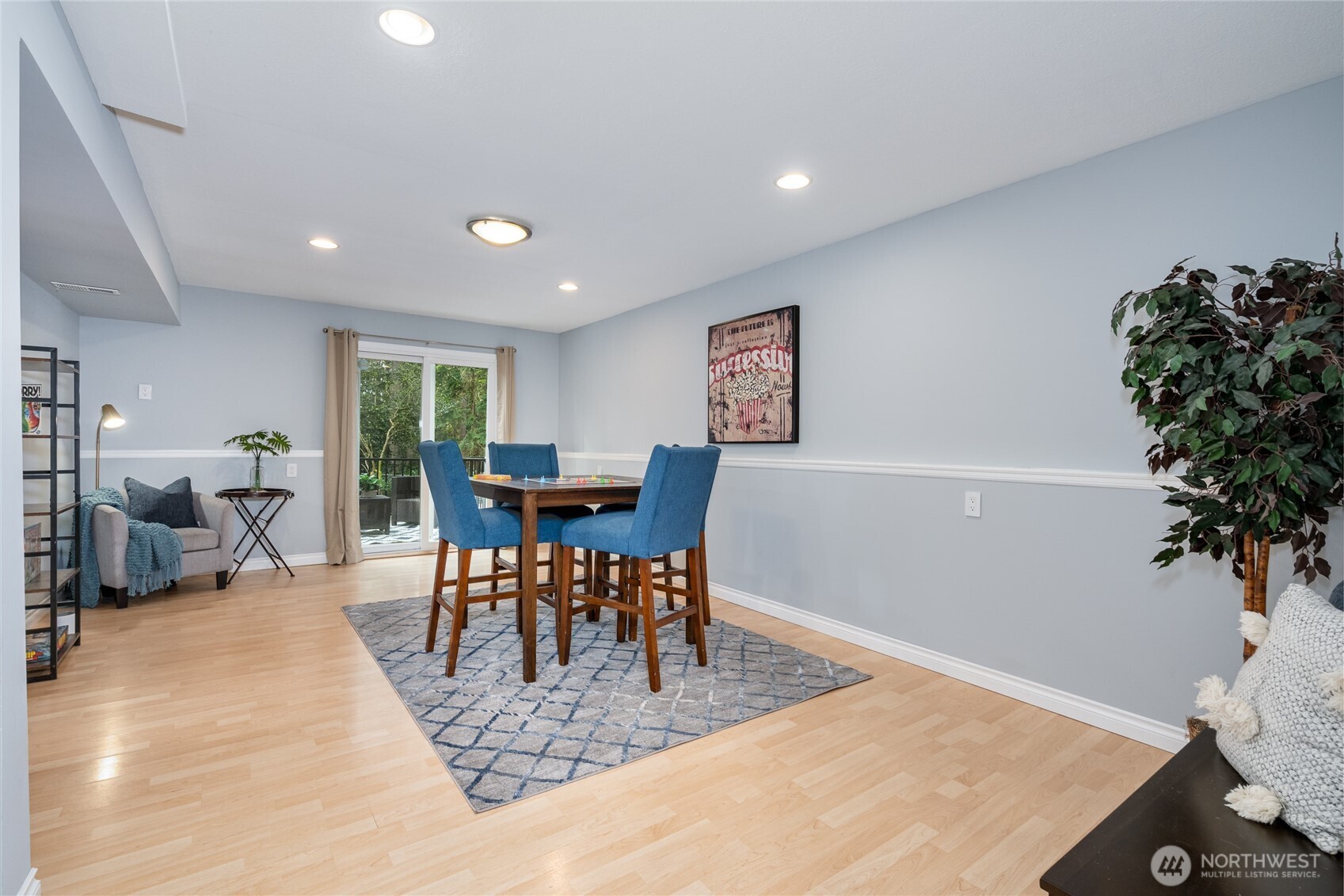 3113 198th Place Southeast Bothell, WA 98012 - Photo 16 of 32 a view of a dining room with furniture and a potted plant