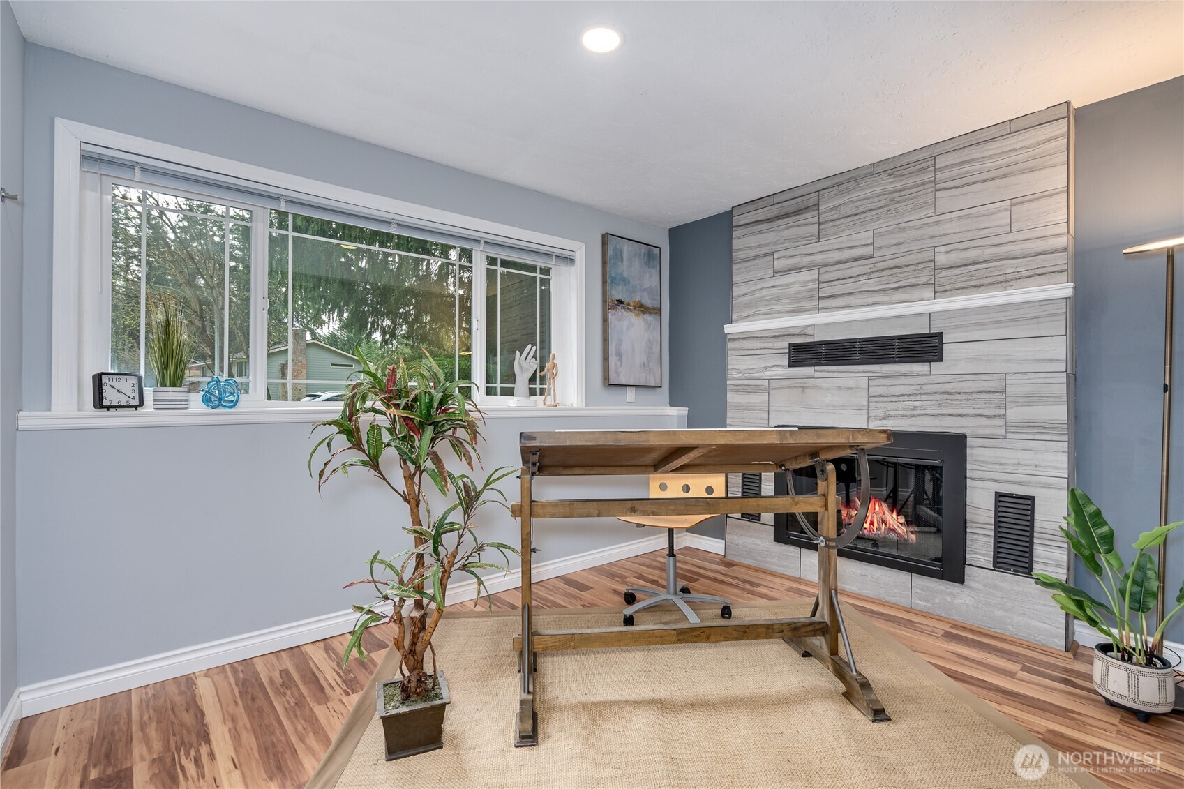 3113 198th Place Southeast Bothell, WA 98012 - Photo 18 of 32 a living room with furniture and a fireplace