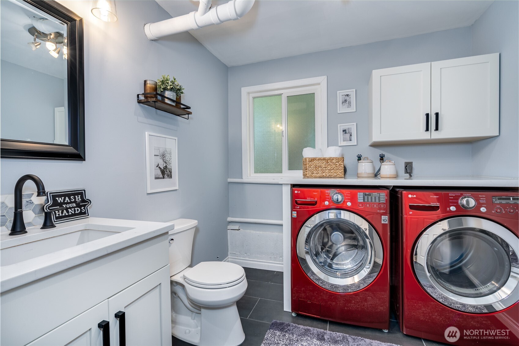 3113 198th Place Southeast Bothell, WA 98012 - Photo 19 of 32 a bathroom with a washing machine and a sink
